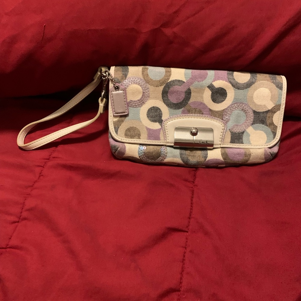 Small white and purple coach wristlet